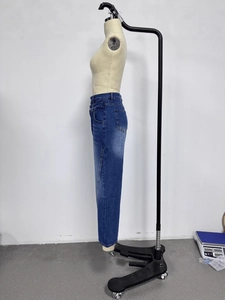 High-waisted wide-leg denim jeans in dark blue wash with distressed fade effect