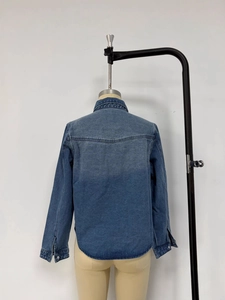 Loose casual blue denim shirt for women with curved hem and back seam detail