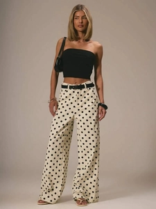 Women's stylish off-white polka dot wide-leg denim trousers with a black tube top