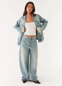 Full view of light blue denim jacket and matching cargo pants set on white background