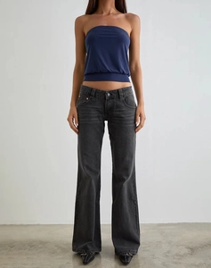 Front view of women slim fit flare jeans in dark wash with low waist minimalist style