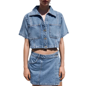 Women's light blue denim two-piece set with cropped button shirt and wrap mini skirt