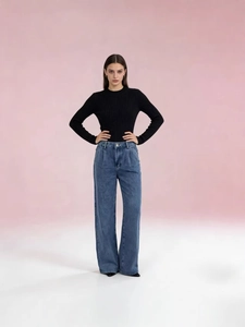 Slim fit black knit top and high waist wide leg jeans for a stylish minimalist woman outfit