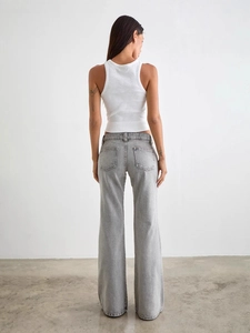 Women's off-white high-waisted wide-leg jeans with back square pockets shown on model