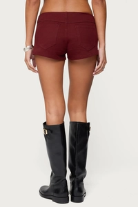 Rear view of slim fit burgundy denim shorts featuring functional back pockets for women