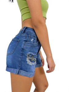 Women's blue denim shorts with geometric embroidery, ripped details and cuffed hem