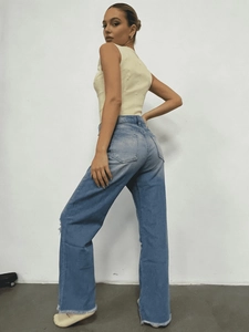 Jean large délavé bleu clair pour femme avec ourlet effiloché et coupe décontractée
