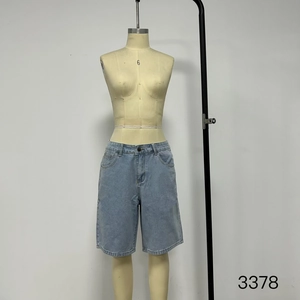 Detail shot of light blue denim shorts with vintage wash and classic five-pocket design
