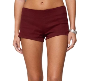Close-up of slim fit wine red denim hot pants featuring a side invisible zipper detail