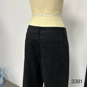Detailed back view of men's washed black tencel denim pants with belt loops and pockets