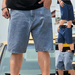 Three shades of loose fit denim shorts shown against a vintage yellow car background