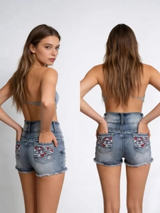 Women high waisted blue denim shorts with star embroidery and frayed hem detail