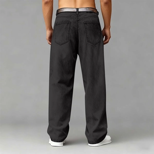 Close-up of the back pockets and loose straight fit design on men's black tencel denim pants