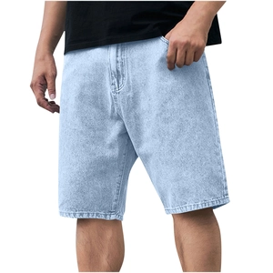 Detailed view of light blue washed denim shorts texture and classic side pocket design