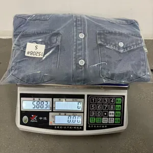 Detailed weight measurement of a washed blue denim shirt for women in size Small