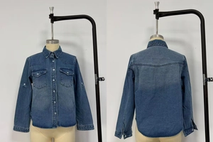 Front and back views of a long-sleeved mid-blue denim shirt with double chest pockets