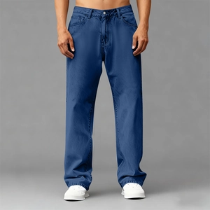 Detail of dark blue men's Tencel denim jeans with classic twill texture and straight cut