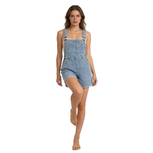 Close-up of light blue denim overalls showing chest pocket and side button details