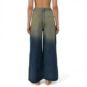 Detail view of vintage gradient wash denim pants featuring a retro yellow to blue fade