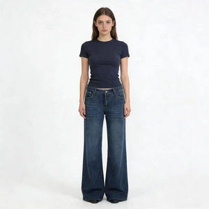 Slim fit charcoal t-shirt and wide leg vintage wash jeans on a studio model