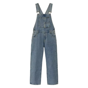 Detail of light blue washed denim overalls featuring adjustable buckles and a front pocket