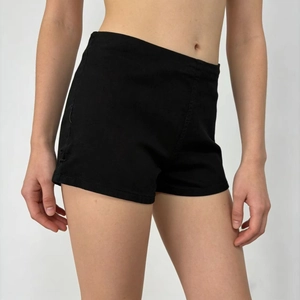 Close-up of high-waisted black stretchy denim shorts featuring a slim fit and fine texture
