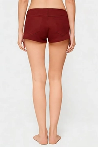Detailed back view of high-waist burgundy shorts with symmetrical pentagonal pockets