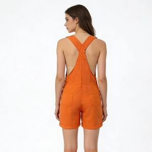 Rear view of orange loose denim overalls featuring X-shaped straps and back pockets
