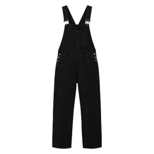 Close-up of black denim overalls with metal buckle straps and large chest pocket detail