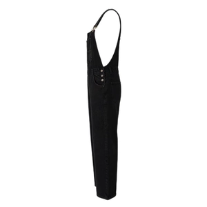Side view of black washed denim overalls showing metal buckles and side button details