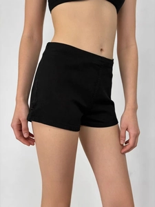Women high waisted black stretch slim denim shorts shown on a model against white background