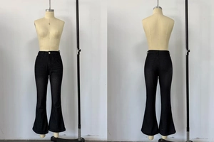 Detail view of charcoal black flare jeans showing high waist and back pocket design