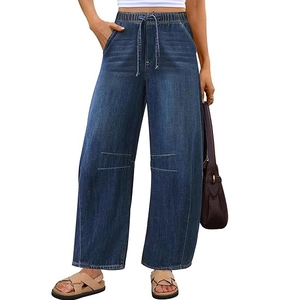 Detail of high-waisted wide-leg jeans with elastic drawstring and knee seam detail