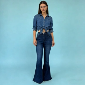 Detail of blue denim shirt with front tie knot and retro washed flare jeans set