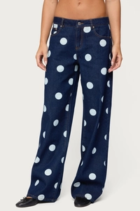 Vue détaillée du jean large taille haute bleu foncé à motif de pois blancs élégant