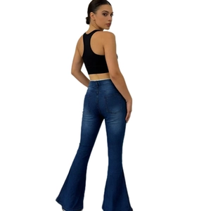 Rear view of high waisted dark blue flare jeans with functional pockets and slim fit
