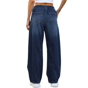 Detail view of wide-leg denim jeans featuring elastic high waist and dual back pockets