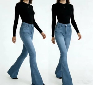 Detail view of retro high-waist flared jeans with vintage wash and stylish flared silhouette