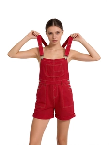 Women's loose red denim overalls featuring multiple pockets and adjustable straps