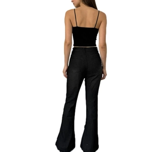 Rear view of high-waisted flare jeans in washed black with back pockets and a slim fit