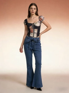 Women's dark blue high-waisted flare jeans with matching bow belt and floral puff sleeve top