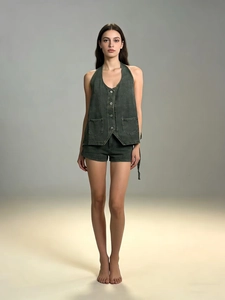 Detail view of a vintage dark grey denim two-piece set with halter vest and matching shorts