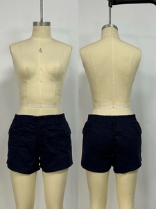 Front and back view of navy blue cargo shorts with elastic waist and flap pockets