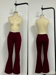 Front and back view of burgundy low-waist flared jeans with stretch fabric and pockets