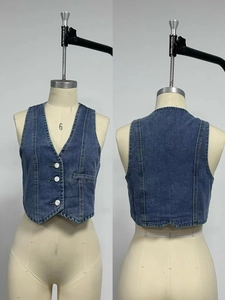 Front and back detail of wash blue denim vest with V-neck and three white buttons