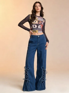 Retro print mesh crop top paired with high waist wide leg jeans with side lace-up details