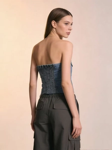 Sexy denim tube top for women featuring back smocking detail and a washed blue finish