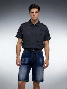 Close-up of men's tactical shirt with epaulettes and blue denim shorts with drawstring