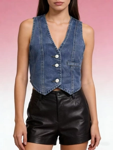 Detail of a vintage dark blue denim vest featuring V-neck and large white buttons