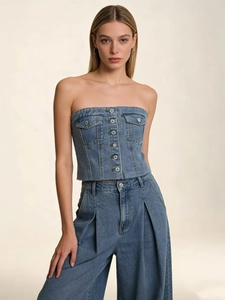 Detail of denim tube top with button-up front, cargo pockets and frayed hem for women